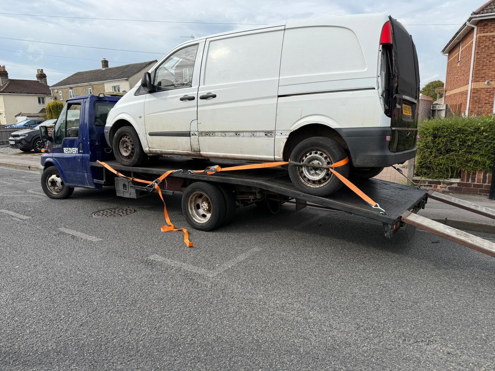 Staff delivering fuel to an out-of-petrol vehicle